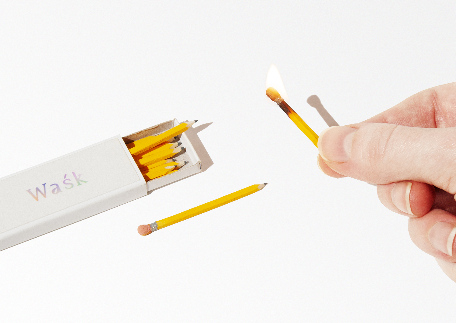 tiny lit match that looks like a pencil