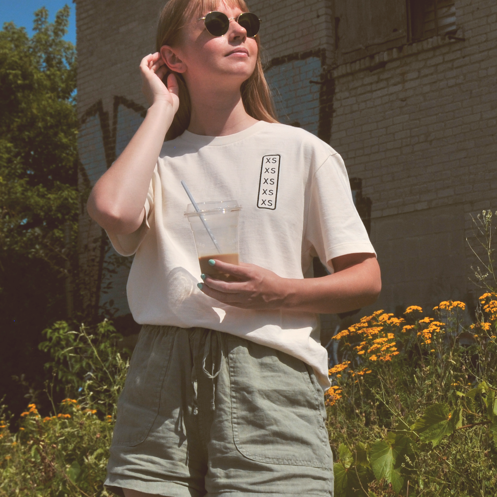 t-shirt featuring embroidered size indicator showing xs xs xs xs  xs